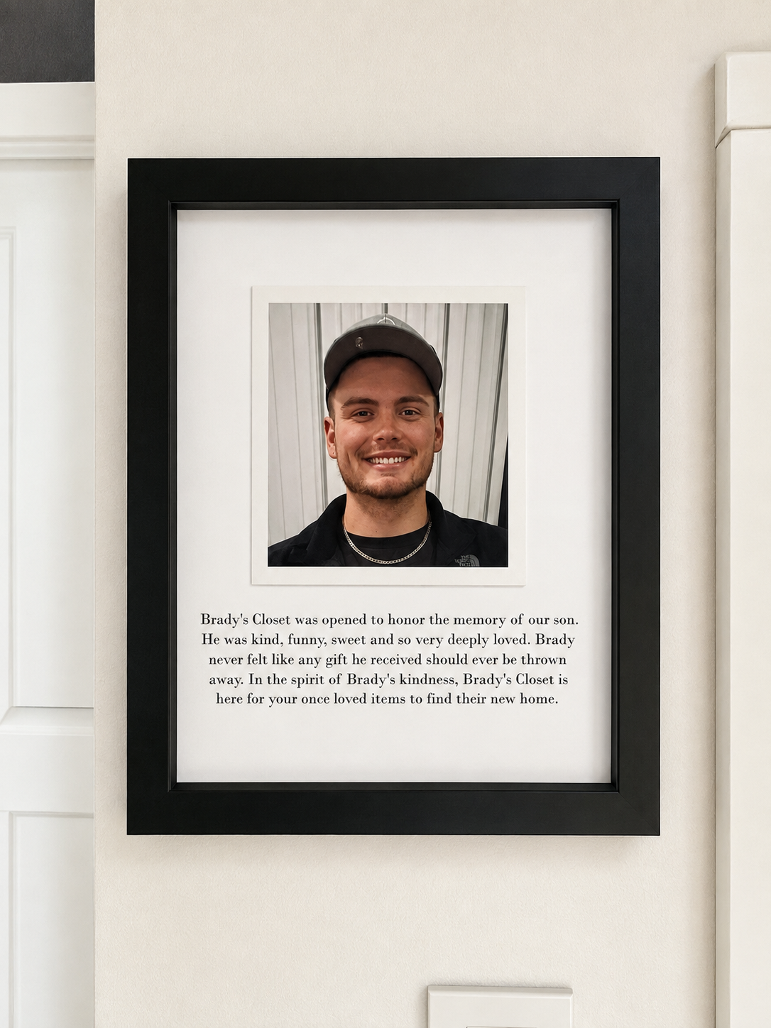 Framed photo and story of Brady displayed inside Brady's Closet